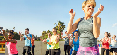 A Group Fitness Instructor and her class..