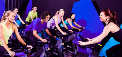 Indoor Cycling instructor leading indoor cycling participants.