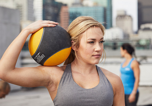 AFAA Trainer Holding a Weight Ball